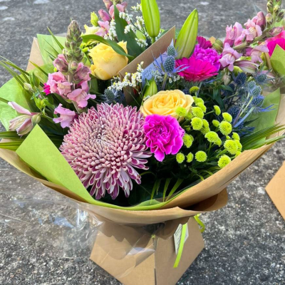 Meadow Breeze - A cheerful mix of seasonal blooms in pink, lilac, lemon yellow, and lavender hues. Features chrysanthemums, carnations, lisianthus and more. Meadow Breeze - A cheerful mix of seasonal blooms in pink, lilac, lemon yellow, and lavender hues. Features chrysanthemums, carnations, lisianthus and more.