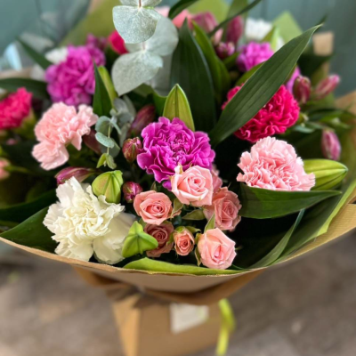 Pink Whispers - A romantic medley of pinks and pastels with carnations, spray roses, lisianthus and eucalyptus for texture. A classic choice with a modern touch. Pink Whispers - A romantic medley of pinks and pastels with carnations, spray roses, lisianthus and eucalyptus for texture. A classic choice with a modern touch.