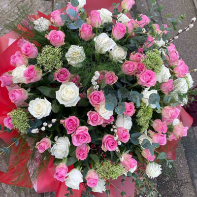 50 Shades of Pink - A grand hand-tied bouquet overflowing with pink and white roses, soft greenery, and fluffy accents. Romantic, extravagant, and unforgettable. 50 Shades of Pink - A grand hand-tied bouquet overflowing with pink and white roses, soft greenery, and fluffy accents. Romantic, extravagant, and unforgettable.