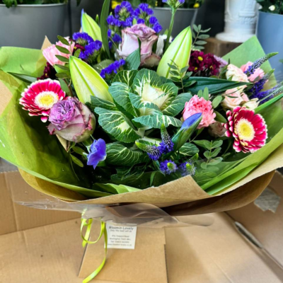 Berry Sorbet - Rich berry tones meet creamy blooms in this unique bouquet of bicolour gerbera, lilac roses, and foliage. A modern, moody mix full of personality. Berry Sorbet - Rich berry tones meet creamy blooms in this unique bouquet of bicolour gerbera, lilac roses, and foliage. A modern, moody mix full of personality.