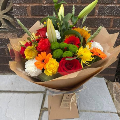 Sunset Sky - A stunning handtied with seasonal flowers a mix of red, orange and yellow, with complimentary foliage. Hand delivered Wellington and surrounding areas by Bloomin Lovely. Sunset Sky - A stunning handtied with seasonal flowers a mix of red, orange and yellow, with complimentary foliage. Hand delivered Wellington and surrounding areas by Bloomin Lovely.
