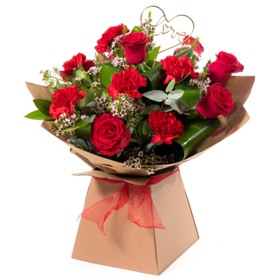 Smooch - 6 red roses and 6 red carnations with choice filler and foliage in a hand-tied or arrangement  in Oasis and presented in a gift bag or box. Smooch - 6 red roses and 6 red carnations with choice filler and foliage in a hand-tied or arrangement  in Oasis and presented in a gift bag or box.