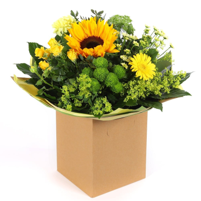 Golden Glow - Brighten someone's day with the `Golden Glow` arrangement, featuring a stunning sunflower mix with seasonal blooms. Complemented by lush green foliage, this arrangement brings a touch of nature's radiant beauty into any space.
 Golden Glow - Brighten someone's day with the `Golden Glow` arrangement, featuring a stunning sunflower mix with seasonal blooms. Complemented by lush green foliage, this arrangement brings a touch of nature's radiant beauty into any space.